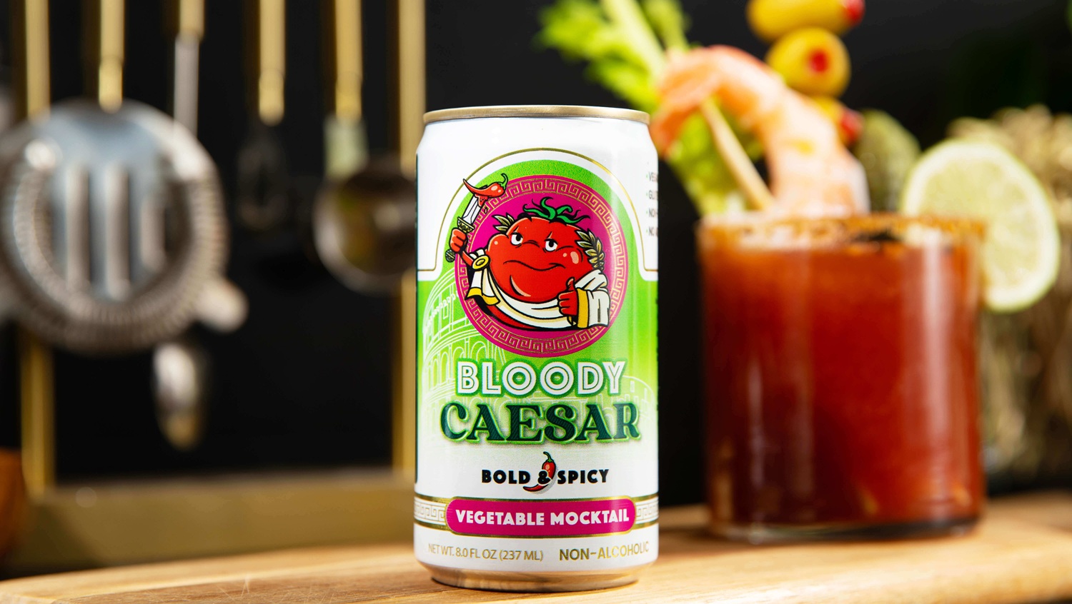 Vegetable juice can with Bloody Caesar in background