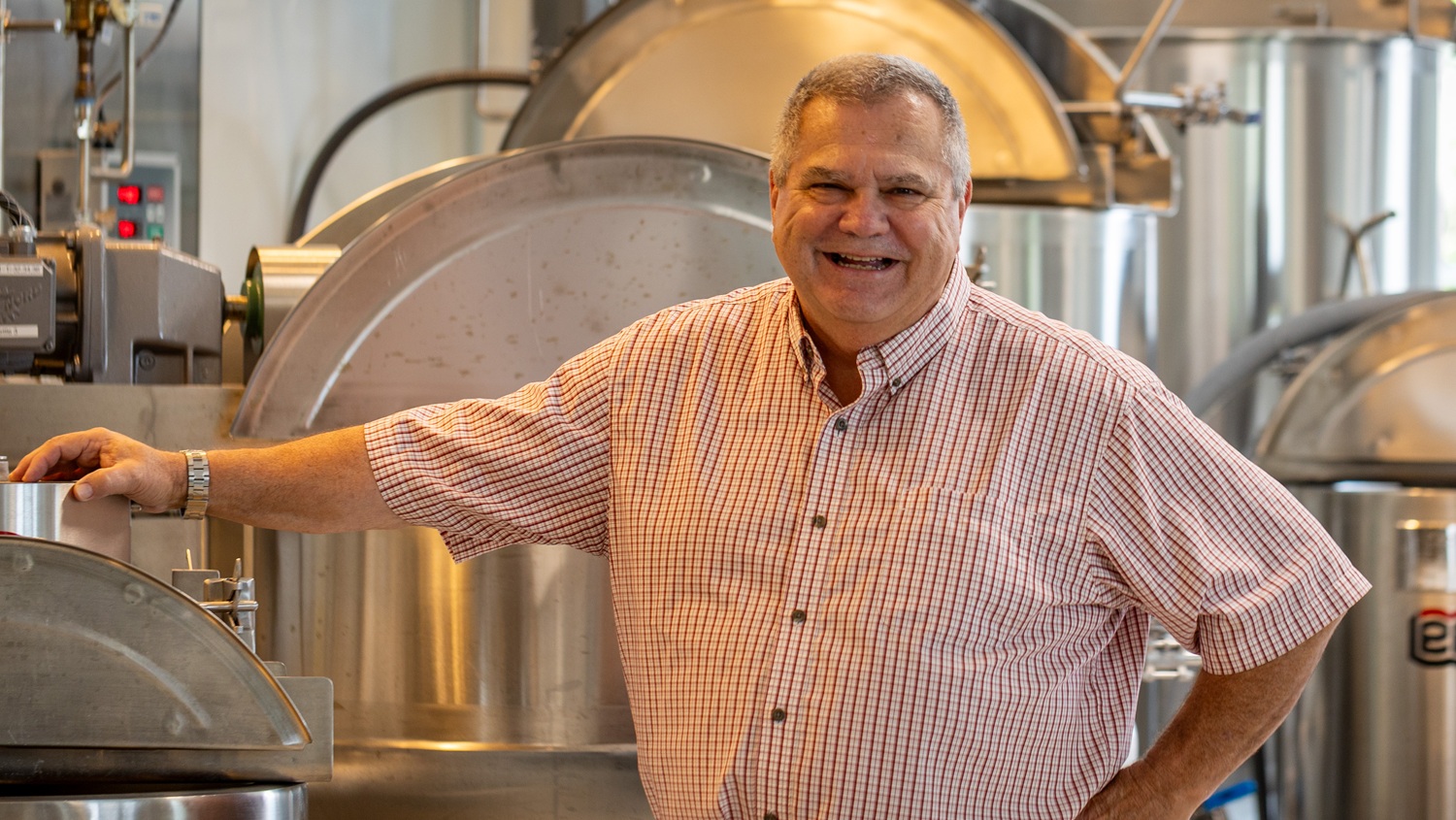 Man smiling in front of NCFIL equipment