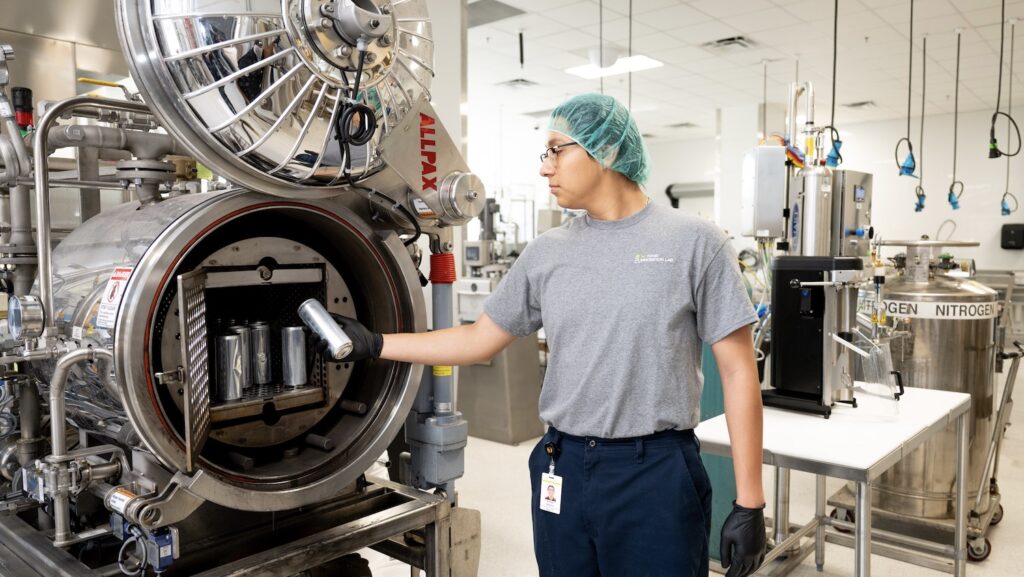 NCFIL Food Scientists Rodrigo Martinez works in the Pilot Plant on a functional beverage