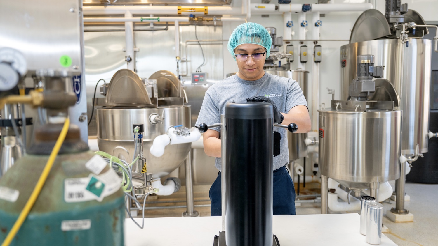 NCFIL Food Scientist Rodrigo Martinez in a Pilot Plant working on functional beverage