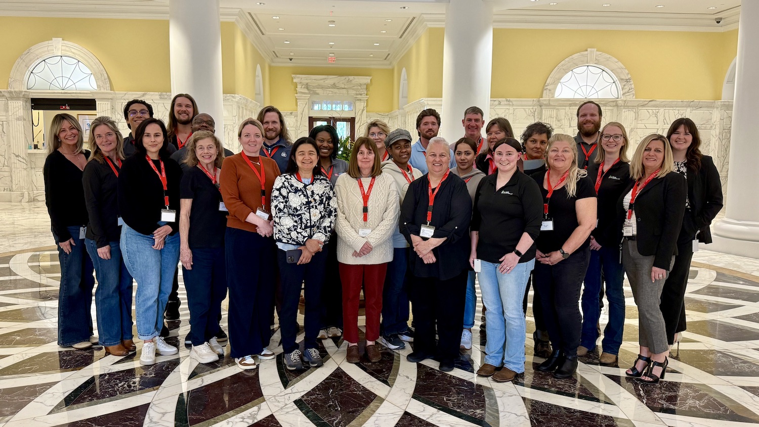 A group of people standing together in building housing NCFIL.