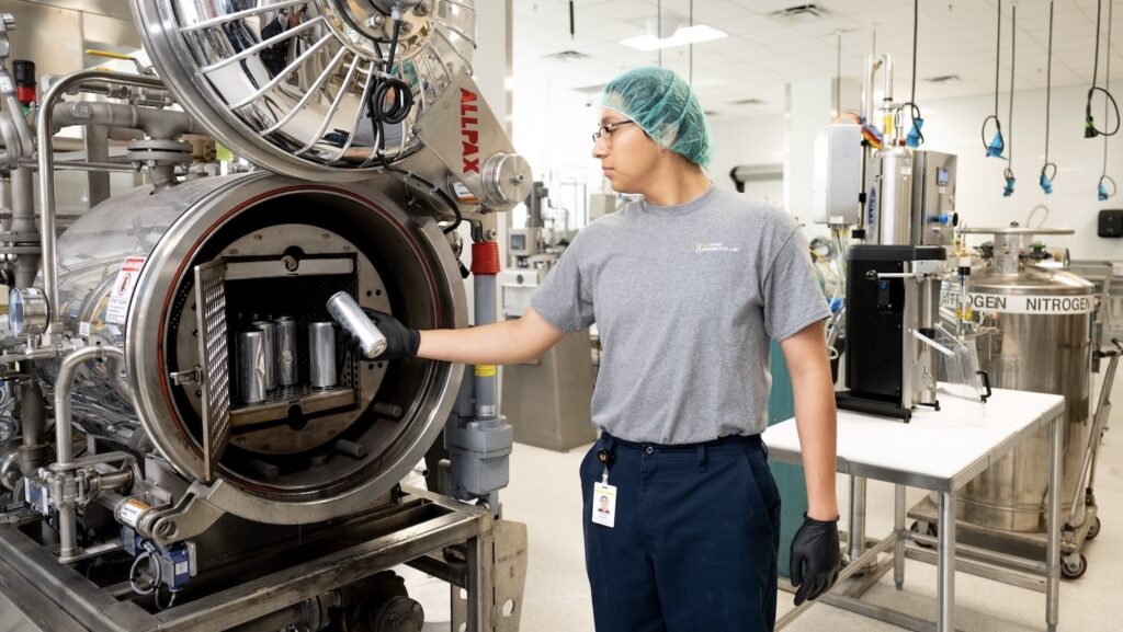 NCFIL Pilot Plant Operator Rodrigo Martinez works in the lab.